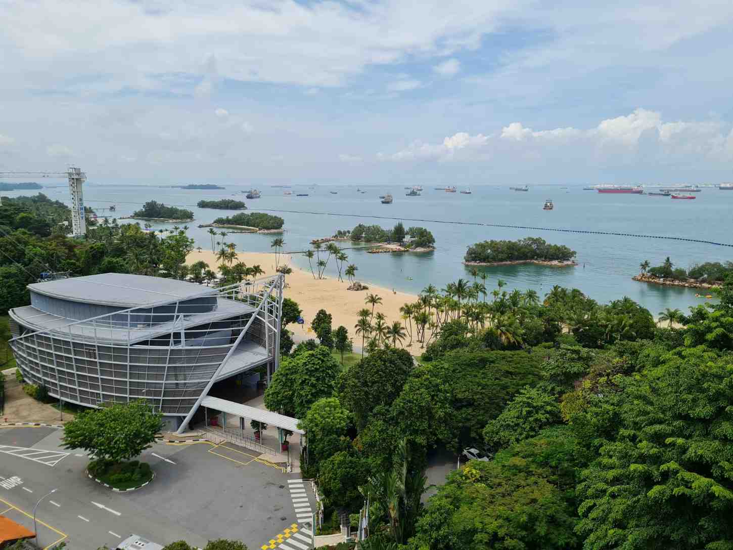 Sentosa Island beach view with palm trees and blue sea — one of the best places to visit in Singapore