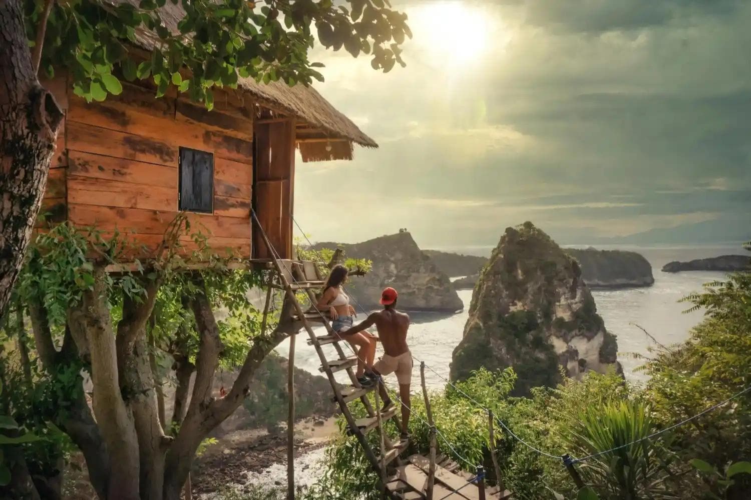 Couple enjoying a romantic cliffside treehouse view in Bali, one of the top things to do in Bali for couples