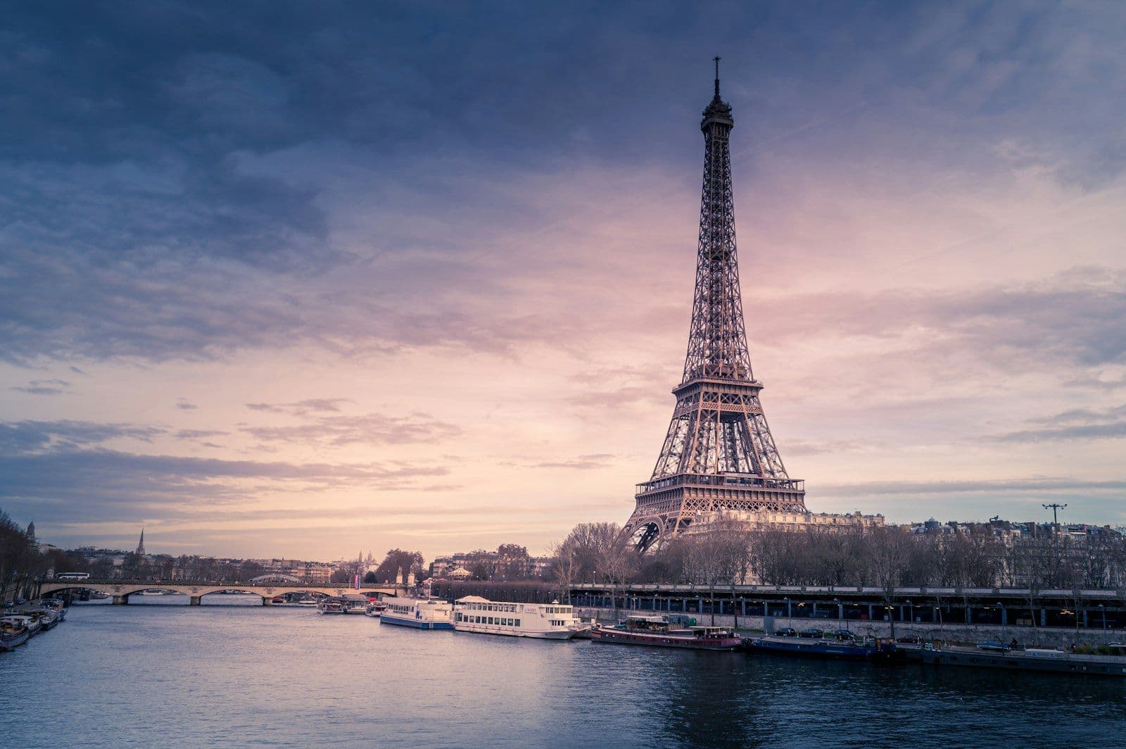 Travellers enjoying a summer evening near the Eiffel Tower